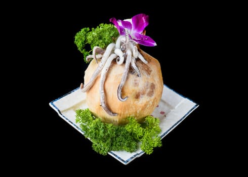 Vietnamese squid cocktail with squid meat in coconut isolated for a menu
