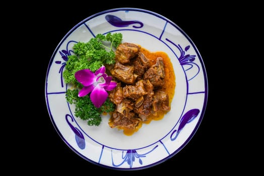Braised pork ribs with lemongrass isolated on black background
