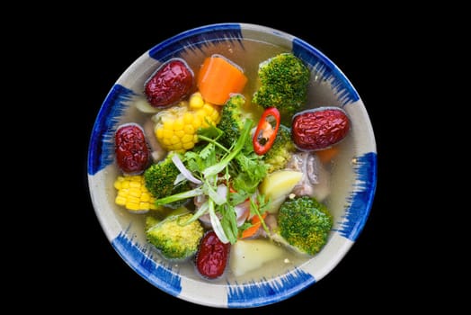 Vietnamese soup with beef, vegetables and goji berries