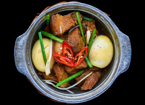 Vietnamese braised pork with boiled eggs in soy sauce for a menu