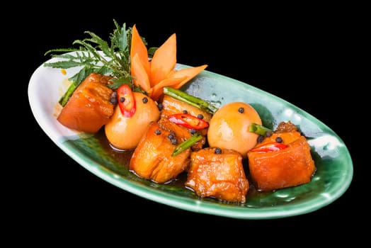 Vietnamese braised pork with boiled eggs in soy sauce for a menu