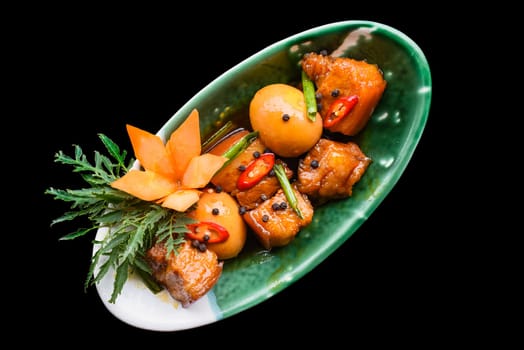 Vietnamese braised pork with boiled eggs in soy sauce for a menu