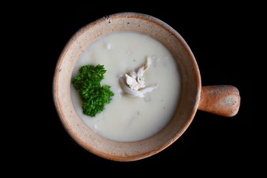 Mushrooms Soup with chicken isolated on black background top view