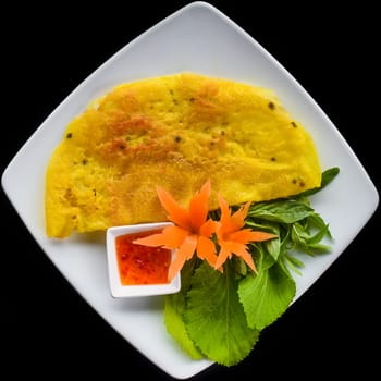Vietnamese pancake with sea food on black background top view