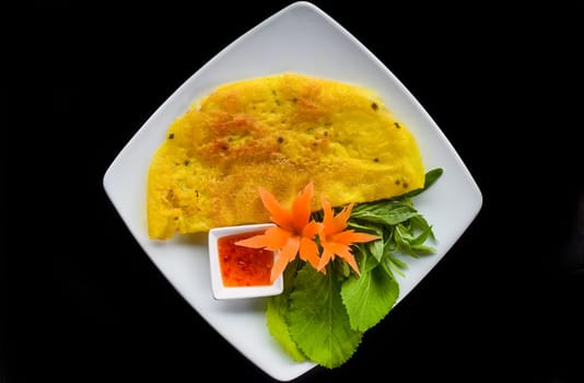 Vietnamese pancake with sea food on black background top view