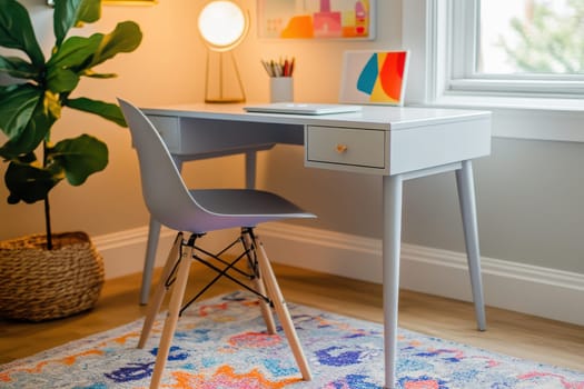 A desk with a chair and a plant in front of it. The desk is white and has a drawer