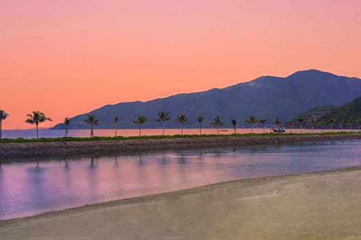 Red romantic sunset in tropics against south china sea in vietnam