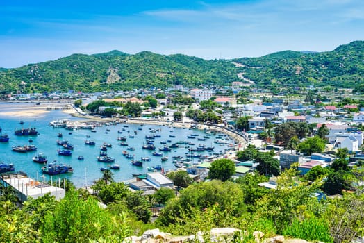 View on Vietnamese fishing village with many boats on the water