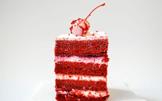Cake Red velvet with whipped cream and white chocolate covered cherry