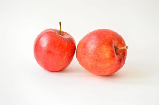 Large appetizing red apples isolated on white background