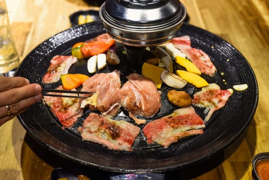 Traditional korean bbq with chicken, beef and vegetables