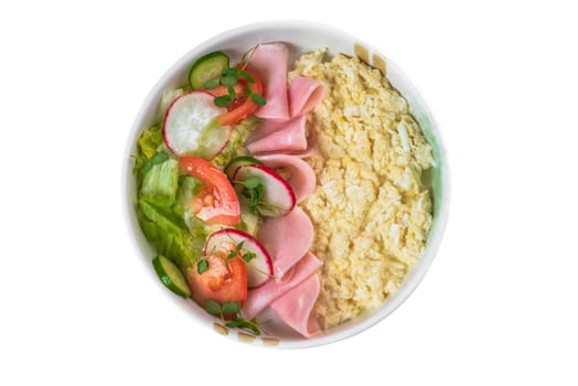 Scrambled eggs with ham and fresh salad in white plate on white background