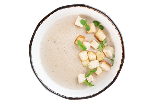 Mushrooms Soup with crackers isolated on white background top view