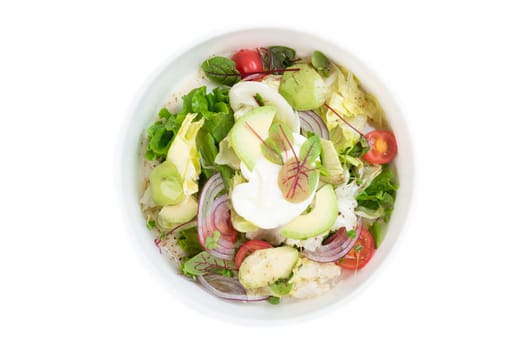 Vegetarian detox salad with avocado, onion, tomato and olive oil