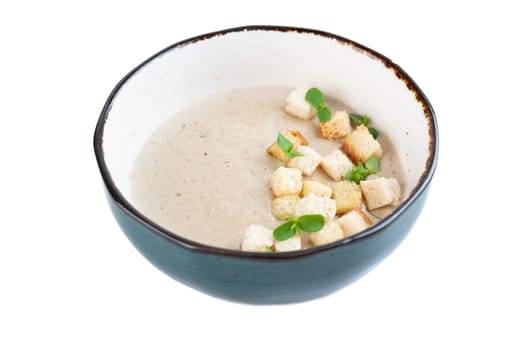 Mushrooms Soup with crackers isolated on white background top view