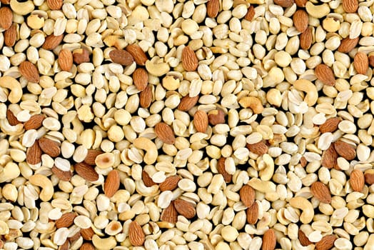 Pile of mixed nuts of almond, hazelnut, peanut and cashew