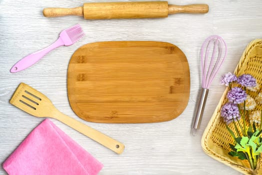 Kitchen utensils on a wooden table with copy space