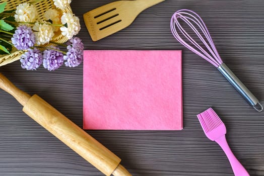 Kitchen utensils for bakery with space for text on a wooden table