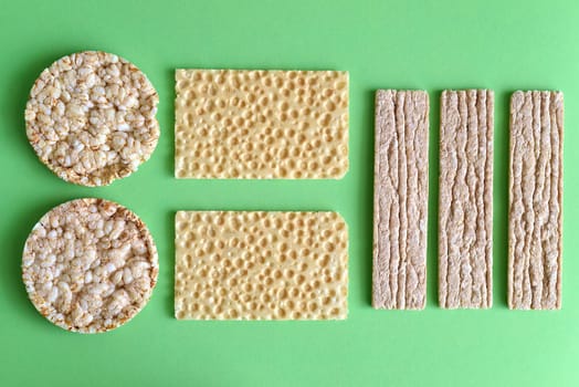 Types of diet whole grain crisps on a green background