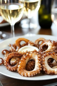 Fried octopus on a plate and a glass of wine. selective focus. Generative AI, food