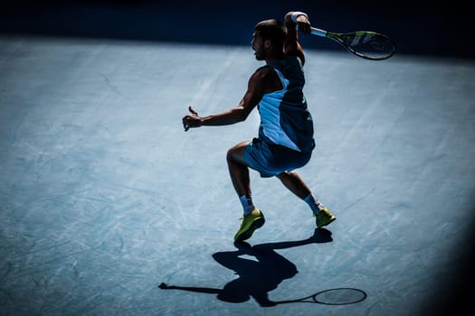 MELBOURNE, AUSTRALIA - JANUARY 19: Carlos Alcaraz of Spain hits a forehand to Jack Draper of Great Britain on day eight of the 2025 Australian Open at Melbourne Park on January 19, 2025 in Melbourne, Australia.