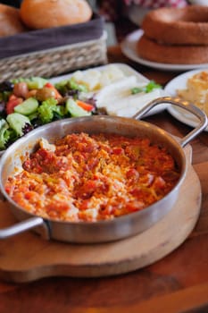 Turkish Menemen omelet in a frying pan.