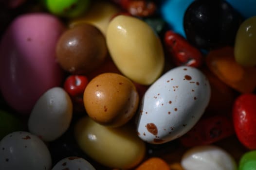 A vibrant collection of assorted candies in various colors and shapes brings a cheerful ambiance to any setting.