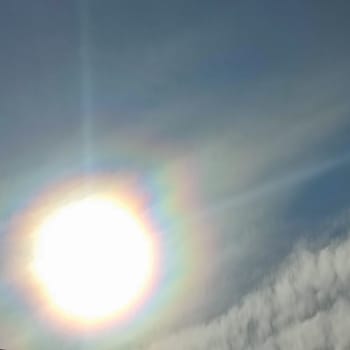 Sun lights white blue sky nature background clouds . High quality photo