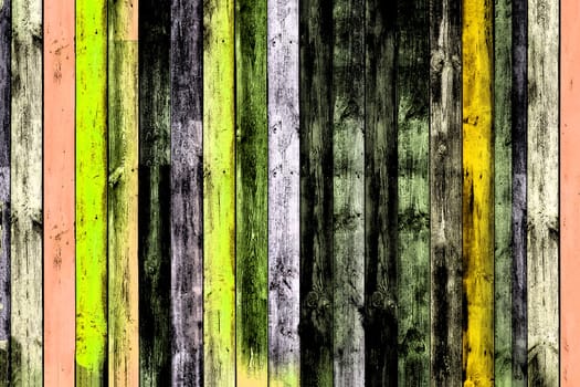 Background image of a multi colored vertical old board in close-up