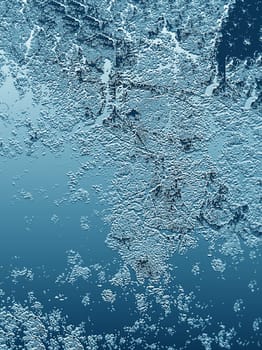 Abstract blue textured ice background close-up from above