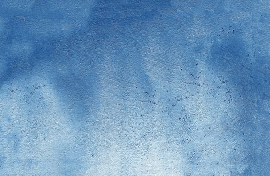 A wall with a textured, rough and scratched blue surface. Texture or background