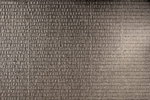 Corrugated old cardboard in grunge brown color close-up view from above