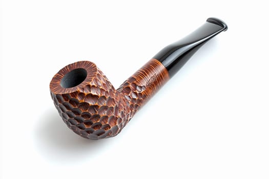 A beautifully crafted wooden smoking pipe sits on a white surface, showcasing its intricate design.