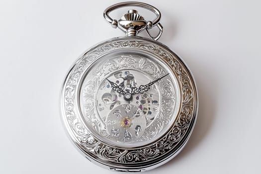 A finely crafted pocket watch displays detailed engravings and exposed gears, reflecting skill.