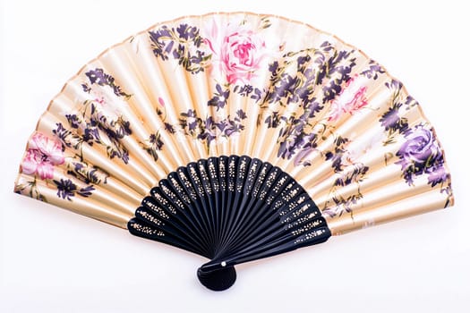 Floral-patterned fan, ideal for decoration or personal use in any setting.