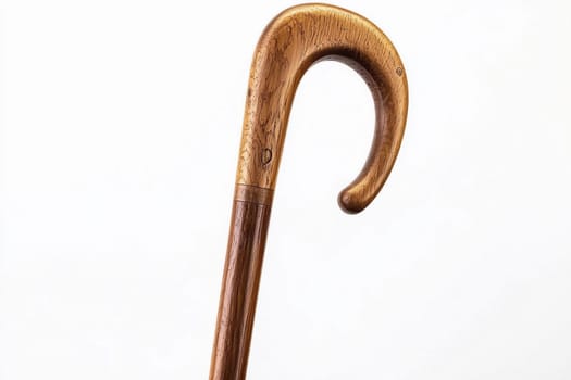 A beautifully crafted wooden cane showcases its unique curved handle and smooth finish.