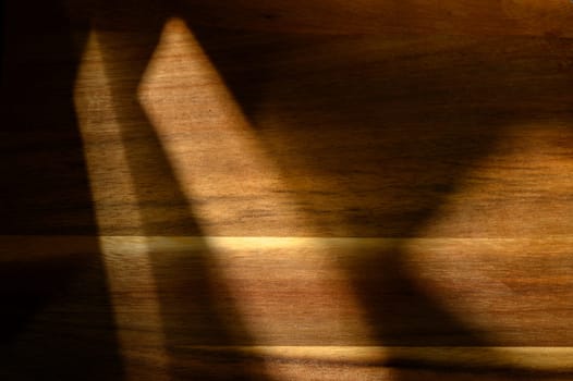 Intricate patterns of light and shadow blend harmoniously, evoking a sense of tranquility and warmth in the evening.