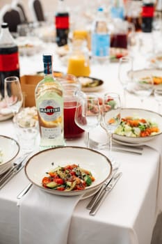 a banquet in a restaurant, a birthday party, a wedding. Beautiful banquet table with dishes.