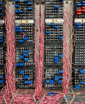 Fiber optical network cables panel. Old telephone cross connection box.