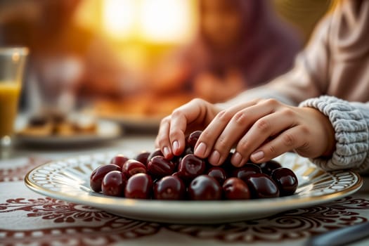 A symbolic moment of Ramadan as hands reach for fresh dates on a decorative plate, preparing for Iftar. The warm evening light enhances the feeling of family unity and spiritual tradition