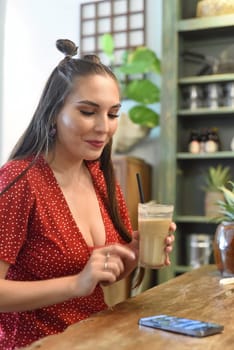 Young woman surfing the internet in the cafe