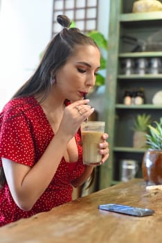 Young woman surfing the internet in the cafe