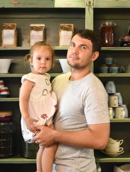 A father holding his child girl