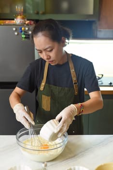 Young Vietnamese woman mixing