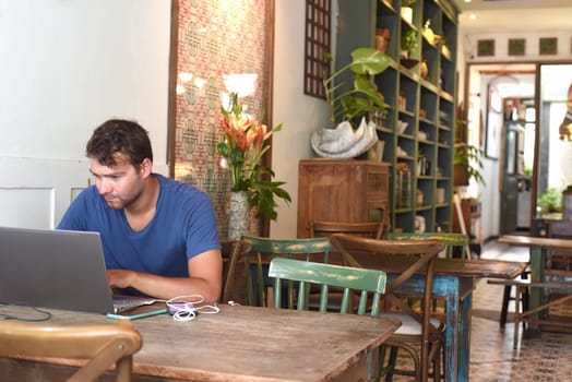 Young freelancer working in a cafe