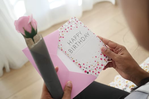 Celebrating a special birthday with a card and a decorative flower.