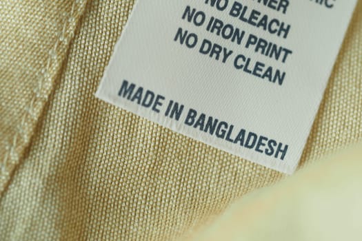 A label providing care instructions, indicating it was made in Bangladesh.