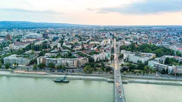 Aerial view of Novi Sad Serbia with Danube river bridge and urban architecture at sunset