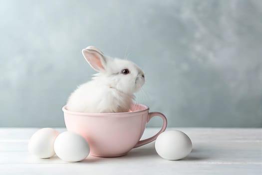 A cute baby rabbit nestled in a pink teacup with white eggs nearby, perfect for Easter or spring-themed content. Easter celebration concept