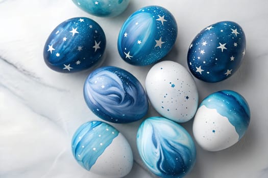 A beautifully painted set of glossy Easter eggs in shades of blue, decorated with starry patterns and galaxy-inspired swirls, perfect for Easter celebrations.